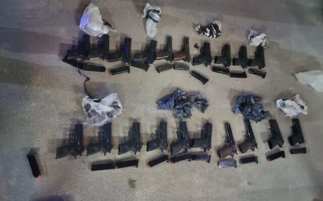 Weapons seized by police officers near Tel Arad in southern Israel, after an alleged gun-smuggling over the border with Jordan on May 2, 2022. (Israel Police) Weapons seized by police officers near Tel Arad in southern Israel, after an alleged gun-smuggling over the border with Jordan on May 2, 2022. (Israel Police)
