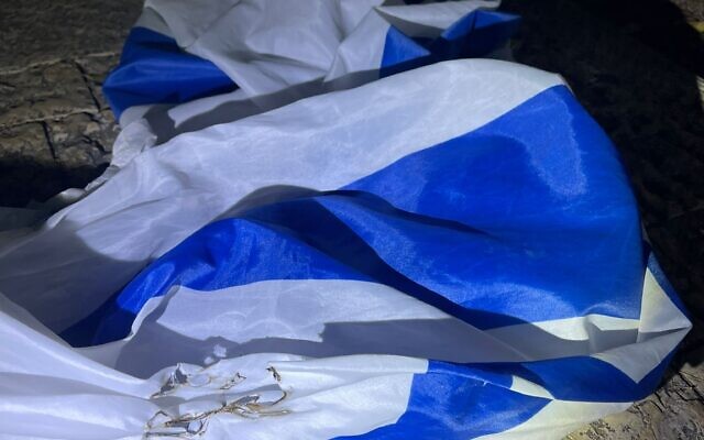 An Israeli flag that police say a pair of Haifa residents tried to burn on May 3, 2022. (Israel Police) An Israeli flag that police say a pair of Haifa residents tried to burn on May 3, 2022. (Israel Police)