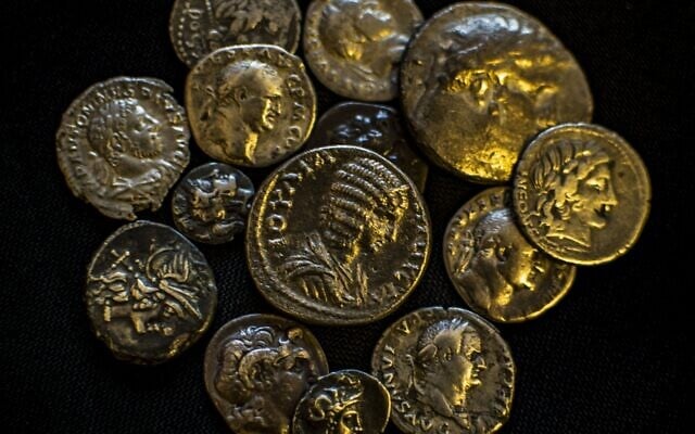 Some of the ancient coins seized in a massive illegal trade bust on May 15, 2022. (Yoli Schwartz/Israel Antiquities Authority)