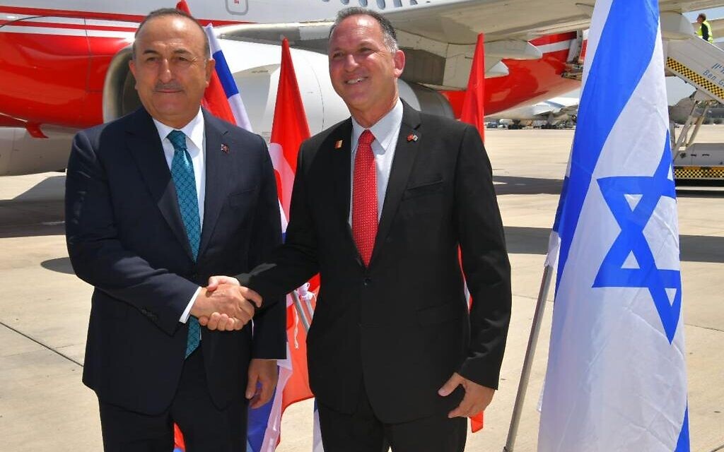 Turkish FM Mevlut Cavusolgu is greeted in Israel by Gil Haskel, the Foreign Ministry's protocol chief, May 24, 2022 (Shlomi Amsalem/GPO) Turkish FM Mevlut Cavusolgu is greeted in Israel by Gil Haskel, the Foreign Ministry's protocol chief, May 24, 2022 (Shlomi Amsalem/GPO)