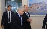 Foreign Minister Yair Lapid, center speaks with his Turkish counterpart Mevlut Cavusoglu at the Foreign Ministry in Jerusalem, May 25, 2022. (Asi Efrati/ GPO)