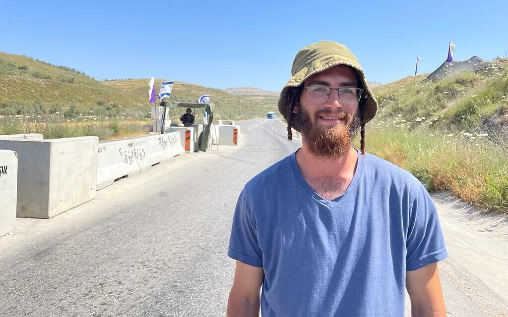 Yeshiva student Asher Katzman at a checkpoint blocking the road to Homesh, May 26, 2022. (Carrie Keller-Lynn/The Times of Israel)