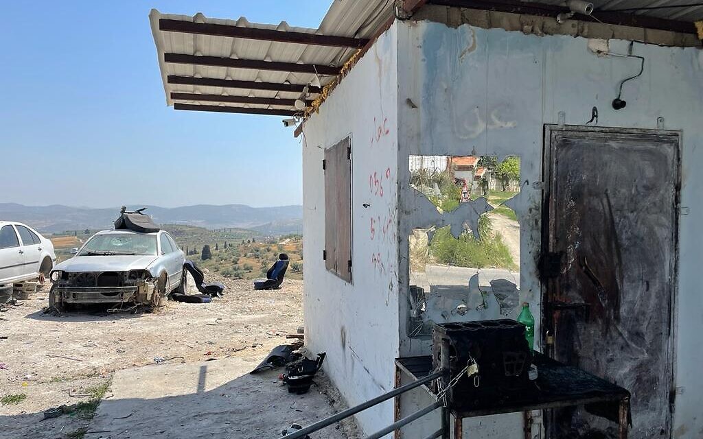 A broken mirror in a workshop at the entrance to the Palestinian village Burqa, May 26, 2022. (Carrie Keller-Lynn/The Times of Israel)