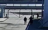 Surveillance footage published by CNN shows Russian soldiers shooting two civilians in the back on March 16, 2022, on the outskirts of Kyiv. (Screenshot)