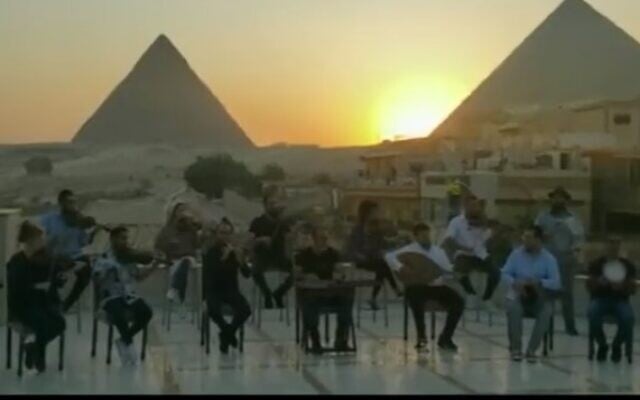 Israel's Firqat Alnoor orchestra plays in front of the pyramids in Cairo as part of the Israeli Embassy's Independence Day celebrations in May 2022. (Screencapture/Kan) Israel's Firqat Alnoor orchestra plays in front of the pyramids in Cairo as part of the Israeli Embassy's Independence Day celebrations in May 2022. (Screencapture/Kan)
