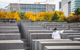 A tourist takes a selfie inside the Memorial to the Murdered Jews of Europe in Berlin, on September 25, 2019. (Beata Zawrzel/NurPhoto via Getty Images via JTA)