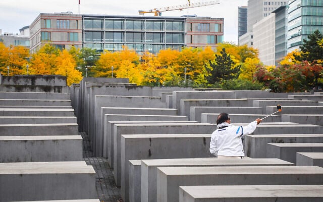 A tourist takes a selfie inside the Memorial to the Murdered Jews of Europe in Berlin, on September 25, 2019. (Beata Zawrzel/NurPhoto via Getty Images via JTA) A tourist takes a selfie inside the Memorial to the Murdered Jews of Europe in Berlin, on September 25, 2019. (Beata Zawrzel/NurPhoto via Getty Images via JTA)
