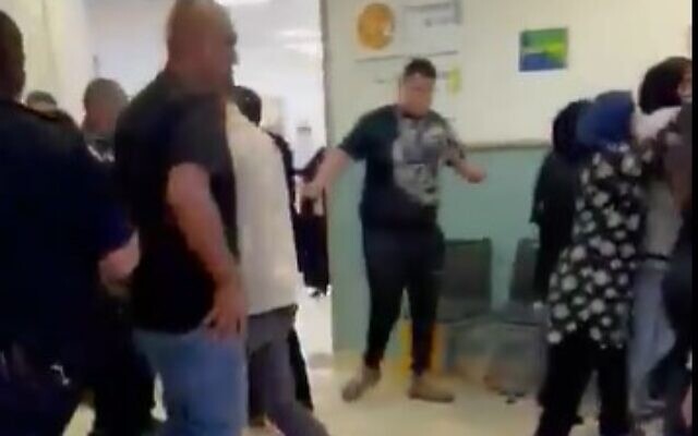 Family members and security guards clash at the Galilee Medical Center on May 18, 2022 (Screencapture/Channel 12) Family members and security guards clash at the Galilee Medical Center on May 18, 2022 (Screencapture/Channel 12)