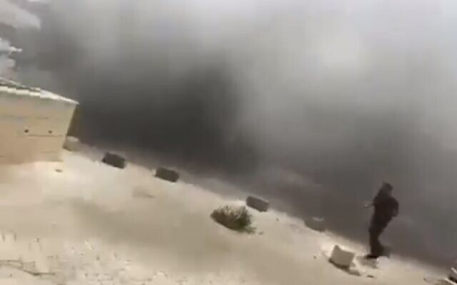 Fire at a garage in the southern town of Hura, May 21, 2022. (Screen grab/Kan)