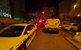 The scene in Kiryat Ata where a 62-year-old woman was found stabbed to death in the stairwell of a residential building, May 7, 2022. (Magen David Adom)