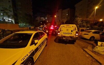 The scene in Kiryat Ata where a 62-year-old woman was found stabbed to death in the stairwell of a residential building, May 7, 2022. (Magen David Adom)