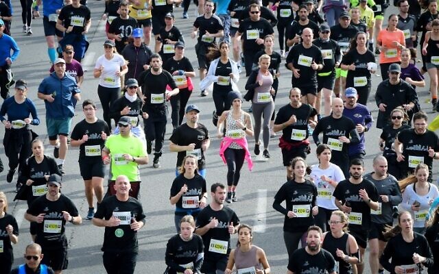 Runners take part in a marathon in Israel's coastal city of Tel Aviv on February 25, 2022. (Avshalom Sassoni/Flash90) Runners take part in a marathon in Israel's coastal city of Tel Aviv on February 25, 2022. (Avshalom Sassoni/Flash90)