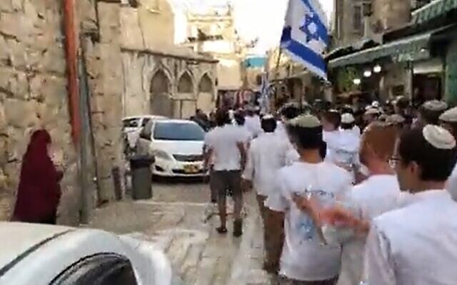 Israeli youths march through the Muslim Quarter in Jerusalem's Old City on May 28, 2022, on the eve of the Jerusalem Day flag parade. (Screenshot/Twitter) Israeli youths march through the Muslim Quarter in Jerusalem's Old City on May 28, 2022, on the eve of the Jerusalem Day flag parade. (Screenshot/Twitter)