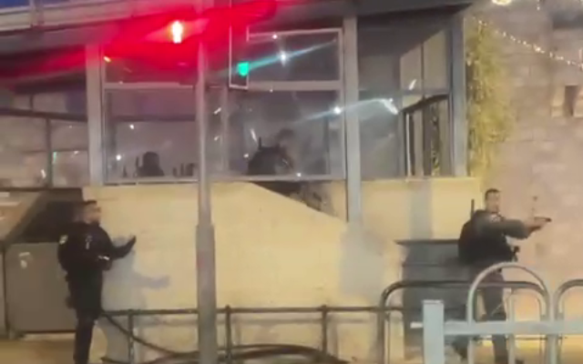 Police officers at the scene of a stabbing attack at Jerusalem's Damascus Gate, on May 8, 2022. (Screenshot: Twitter)