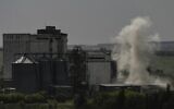Smoke rises during shelling at a factory in the city of Soledar in the region of Donbas, eastern Ukraine, June 3, 2022. (Aris Messinis/AFP)