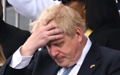 Britain's Prime Minister Boris Johnson reacts during the Platinum Pageant in London on June 5, 2022 as part of Queen Elizabeth II's platinum jubilee celebrations (Leon Neal / POOL / AFP)