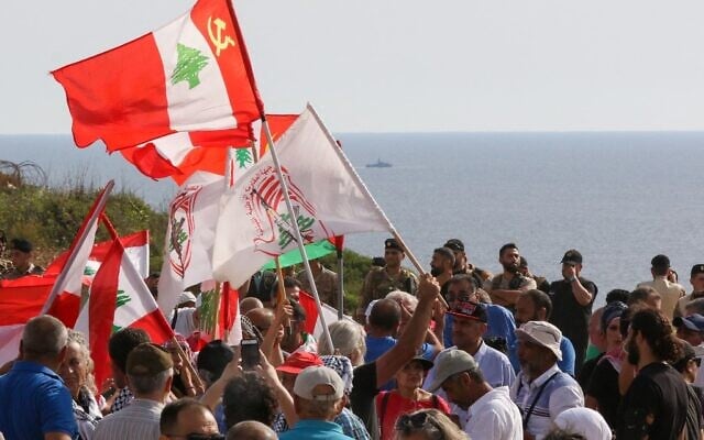 Lebanese protesters take part in a demonstration at the Lebanese southernmost border area of Naqura, on June 11, 2022, days after Israel moved a gas production vessel into an offshore field, a part of which is claimed by Lebanon. (Mahmoud ZAYYAT / AFP) Lebanese protesters take part in a demonstration at the Lebanese southernmost border area of Naqura, on June 11, 2022, days after Israel moved a gas production vessel into an offshore field, a part of which is claimed by Lebanon. (Mahmoud ZAYYAT / AFP)
