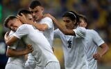 Israeli players celebrate a goal during the UEFA Under-19 European Championship semi-final football match between France and Irsael at the DAC Arena in Dunajska Streda, Slovakia on June 28, 2022. (VLADIMIR SIMICEK / AFP)