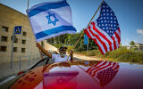 Israeli supporters of Donald Trump wave United States and Israeli flags to support his candidacy outside the US embassy in Jerusalem, on October 27, 2020. (Olivier Fitoussi/Flash90/File)