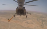 Paratroopers leaping from aircraft during a joint drill conducted by Syrian and Russian militaries, June 25, 2022. (Screengrab/Twitter)