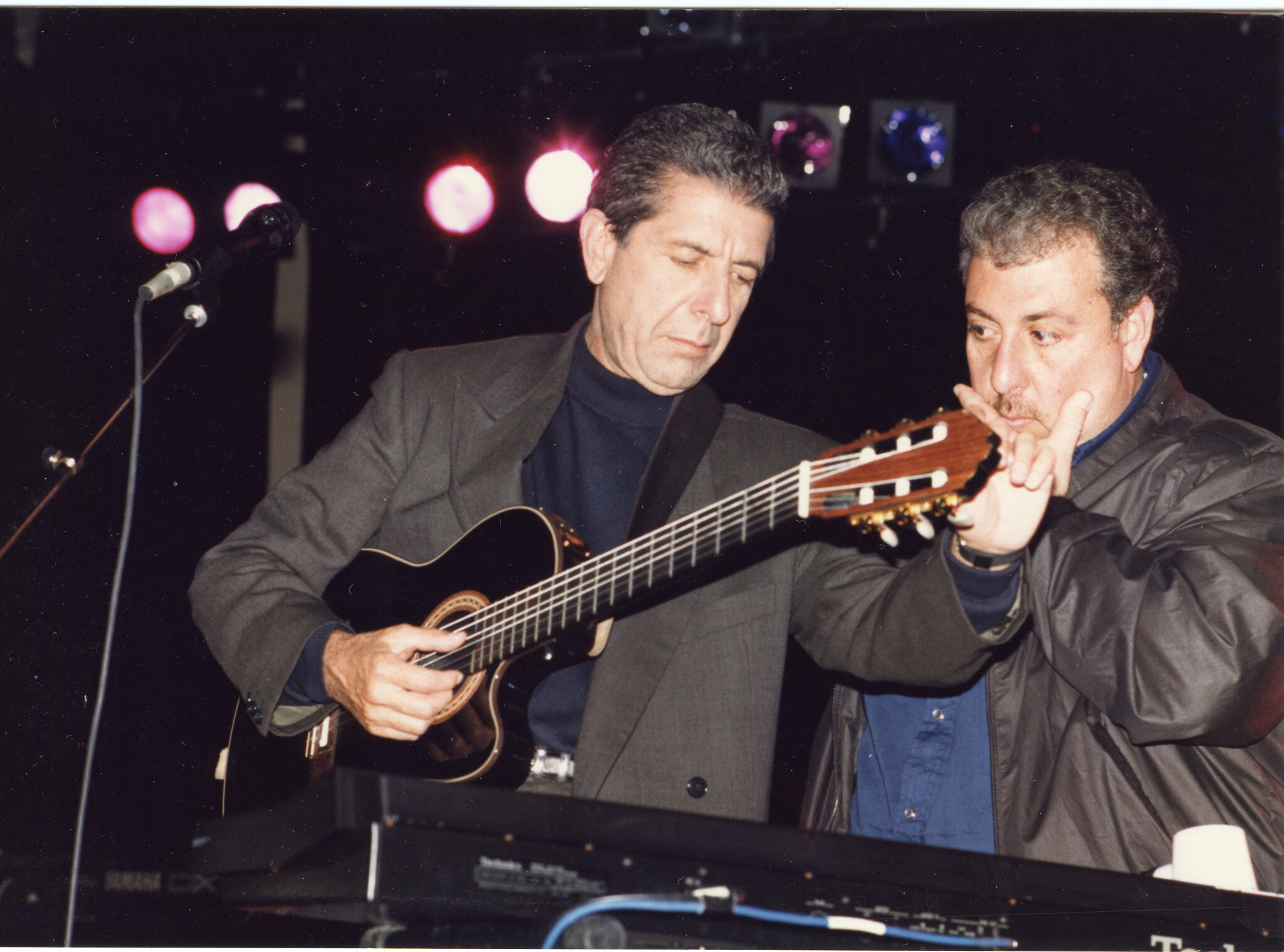 Leonard Cohen tuning his guitar onstage in an undated photo. (Courtesy of Leonard Cohen Family Trust) Leonard Cohen tuning his guitar onstage in an undated photo. (Courtesy of Leonard Cohen Family Trust)