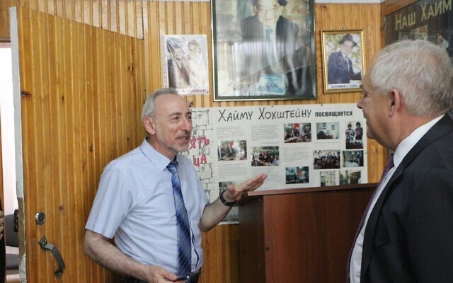 Vladimir Kritsman, left, the principal of Kyrgyzstan's only Jewish school, Pri Etz Haim, gives a tour to EU Ambassador to Kyrgyzstan Eduard Auer on June 27, 2022. (EU in Kyrgyzstan)