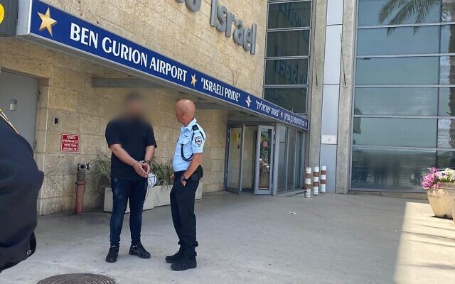 A man heading to his honeymoon is arrested at Ben Gurion Airport on suspcicion he supplied a gun that was used to fire in the air at his wedding, March 30, 2022. (Israel Police) A man heading to his honeymoon is arrested at Ben Gurion Airport on suspcicion he supplied a gun that was used to fire in the air at his wedding, March 30, 2022. (Israel Police)