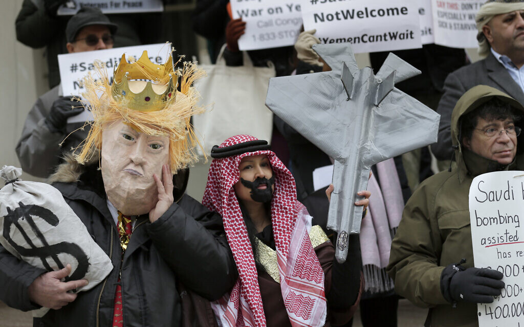 Protesters, some dressed as United States President Donald Trump and Crown Prince Mohammed bin Salman, stand on the steps of City Hall in New York, Tuesday, March 20, 2018. (AP/Seth Wenig) Protesters, some dressed as United States President Donald Trump and Crown Prince Mohammed bin Salman, stand on the steps of City Hall in New York, Tuesday, March 20, 2018. (AP/Seth Wenig)