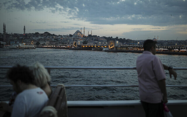 People on a boat cross the Bosporus Strait from Asia to Europe, with a view of Istanbul's skyline with the Suleymaniye Mosque, in the background, June 22, 2019. (AP Photo/Emrah Gurel) People on a boat cross the Bosporus Strait from Asia to Europe, with a view of Istanbul's skyline with the Suleymaniye Mosque, in the background, June 22, 2019. (AP Photo/Emrah Gurel)