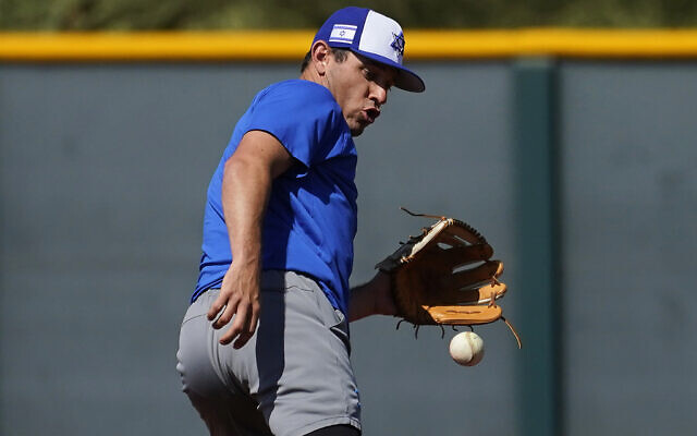 Israel Olympic baseball player Ian Kinsler takes fielding practice at Salt River Fields spring training facility, May 12, 2021, in Scottsdale, Ariz. (AP Photo/Matt York)