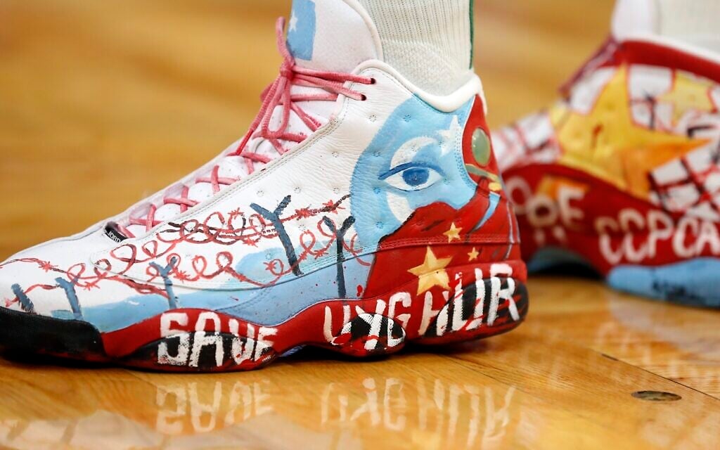 Boston Celtics' Enes Kanter Freedom's shoes on the court during the second half of an NBA basketball game against the Toronto Raptors, November 10, 2021, in Boston. (AP Photo/Michael Dwyer)
