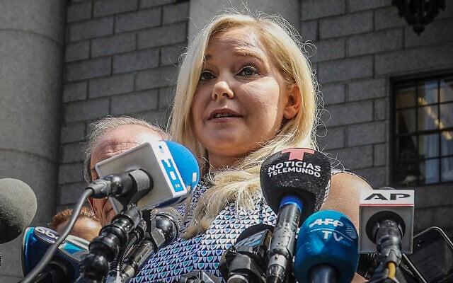 Virginia Roberts Giuffre holds a news conference outside a Manhattan court following the jailhouse death of Jeffrey Epstein, August 27, 2019, in New York. (AP Photo/Bebeto Matthews, File)