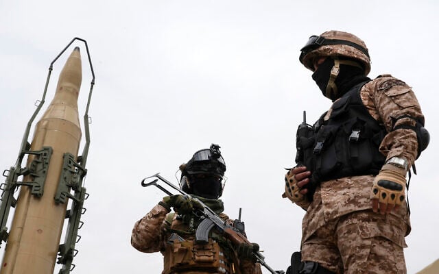 Illustrative: Iran's Revolutionary Guard members stand in front of Shahab-3 missile which is displayed during the annual pro-Palestinians Al-Quds, or Jerusalem, Day rally in Tehran, Iran, April 29, 2022. (AP Photo/Vahid Salemi) Illustrative: Iran's Revolutionary Guard members stand in front of Shahab-3 missile which is displayed during the annual pro-Palestinians Al-Quds, or Jerusalem, Day rally in Tehran, Iran, April 29, 2022. (AP Photo/Vahid Salemi)