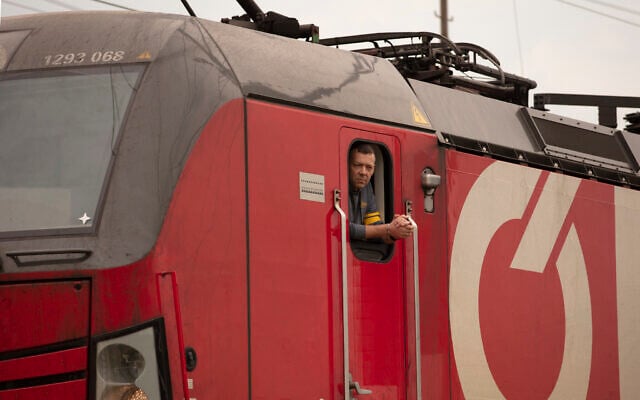 Illustrative: A train driver looks out of his locomotive at the arriving of a freight train in Vienna, Austria, May 6, 2022. In accordance with EU sanctions on Russia, Lithuania has begun to restrict transport of goods to and from Russian exclave Kaliningrad. (AP Photo/Theresa Wey) Illustrative: A train driver looks out of his locomotive at the arriving of a freight train in Vienna, Austria, May 6, 2022. In accordance with EU sanctions on Russia, Lithuania has begun to restrict transport of goods to and from Russian exclave Kaliningrad. (AP Photo/Theresa Wey)