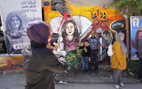 File: Palestinians visit the site where veteran Palestinian-American reporter Shireen Abu Akleh was shot and killed, in the West Bank city of Jenin, May 18, 2022. (AP Photo/Majdi Mohammed, File)