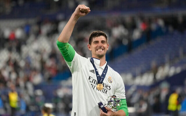Real Madrid's goalkeeper Thibaut Courtois celebrates after winning the Champions League final soccer match between Liverpool and Real Madrid at the Stade de France in Saint Denis near Paris, May 29, 2022. (AP Photo/Kirsty Wigglesworth) Real Madrid's goalkeeper Thibaut Courtois celebrates after winning the Champions League final soccer match between Liverpool and Real Madrid at the Stade de France in Saint Denis near Paris, May 29, 2022. (AP Photo/Kirsty Wigglesworth)