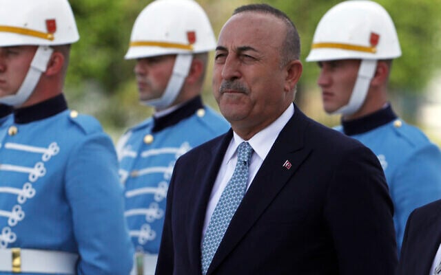 Turkish Foreign Minister Mevlut Cavusoglu stands with a military honor guard, in Ankara, Turkey, June 1, 2022. (Burhan Ozbilici/AP) Turkish Foreign Minister Mevlut Cavusoglu stands with a military honor guard, in Ankara, Turkey, June 1, 2022. (Burhan Ozbilici/AP)