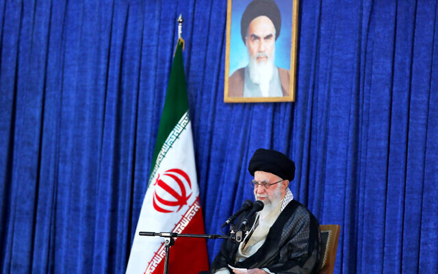 Supreme Leader Ayatollah Ali Khamenei speaks on the anniversary of the death of the late founder of the Islamic Republic, Ayatollah Ruhollah Khomeini, shown in the poster at top center, at his mausoleum in Tehran, Iran, June 4, 2022. (Office of the Iranian Supreme Leader via AP) Supreme Leader Ayatollah Ali Khamenei speaks on the anniversary of the death of the late founder of the Islamic Republic, Ayatollah Ruhollah Khomeini, shown in the poster at top center, at his mausoleum in Tehran, Iran, June 4, 2022. (Office of the Iranian Supreme Leader via AP)