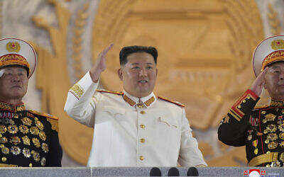 In this photo provided by the North Korean government, North Korean leader Kim Jong Un, center, watches a military parade to mark the 90th anniversary of North Korea's army at the Kim Il Sung Square in Pyongyang, North Korea, on April 25, 2022. (Korean Central News Agency/Korea News Service via AP)