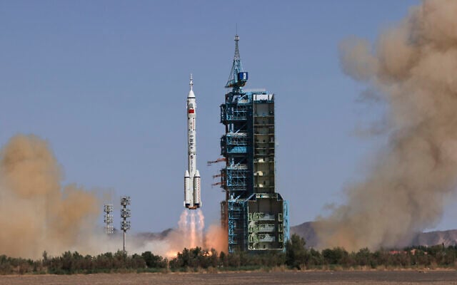 In this photo released by Xinhua News Agency, the Long March-2F carrier rocket carrying China's Shenzhou 14 spacecraft blasts off from the launch pad at the Jiuquan Satellite Launch Center in Jiuquan, northwest China's Gansu Province, Sunday, June 5, 2022. China on Sunday launched the new three-person mission to complete work on its permanent orbiting space station. (Li Gang/Xinhua via AP) In this photo released by Xinhua News Agency, the Long March-2F carrier rocket carrying China's Shenzhou 14 spacecraft blasts off from the launch pad at the Jiuquan Satellite Launch Center in Jiuquan, northwest China's Gansu Province, Sunday, June 5, 2022. China on Sunday launched the new three-person mission to complete work on its permanent orbiting space station. (Li Gang/Xinhua via AP)