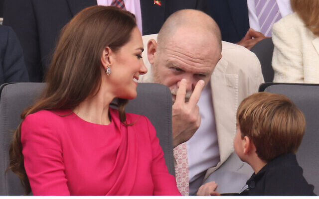 Mike Tindall gestures towards Prince Louis during the Platinum Jubilee Pageant outside Buckingham Palace in London, Sunday June 5, 2022, on the last of four days of celebrations to mark the Platinum Jubilee. The pageant will be a carnival procession up The Mall featuring giant puppets and celebrities that will depict key moments from the Queen Elizabeth II's seven decades on the throne. (Ian Vogler/Pool Photo via AP) Mike Tindall gestures towards Prince Louis during the Platinum Jubilee Pageant outside Buckingham Palace in London, Sunday June 5, 2022, on the last of four days of celebrations to mark the Platinum Jubilee. The pageant will be a carnival procession up The Mall featuring giant puppets and celebrities that will depict key moments from the Queen Elizabeth II's seven decades on the throne. (Ian Vogler/Pool Photo via AP)