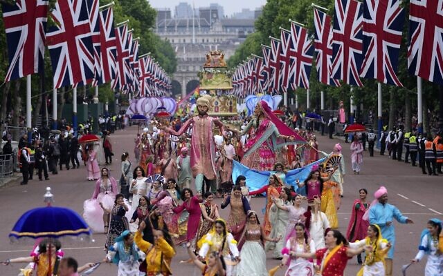 People parade during the Platinum Jubilee Pageant outside Buckingham Palace in London, June 5, 2022, on the last of four days of celebrations to mark the Platinum Jubilee. (AP Photo/Frank Augstein, Pool) People parade during the Platinum Jubilee Pageant outside Buckingham Palace in London, June 5, 2022, on the last of four days of celebrations to mark the Platinum Jubilee. (AP Photo/Frank Augstein, Pool)