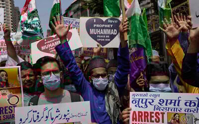 Indian Muslims shout slogans as they react to the derogatory references to Islam and the Prophet Muhammad made by top officials in the governing Hindu nationalist party during a protest in Mumbai, India, Monday, June 6, 2022.  (AP Photo/Rafiq Maqbool)