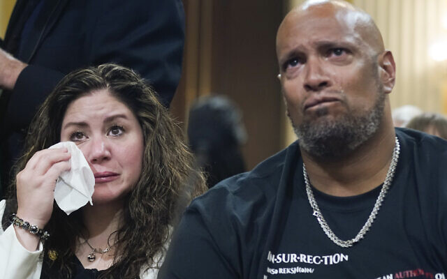U.S. Capitol Police Sgt. Harry Dunn, right, and Sandra Garza, the long-time partner of Capitol Hill Police Officer Brian Sicknick who died shortly after the Jan. 6 attack, left, react as a video of the Jan. 6 attack on the U.S. Capitol is played during a public hearing of the House select committee investigating the attack is held on Capitol Hill, Thursday, June 9, 2022, in Washington. (AP Photo/Andrew Harnik) U.S. Capitol Police Sgt. Harry Dunn, right, and Sandra Garza, the long-time partner of Capitol Hill Police Officer Brian Sicknick who died shortly after the Jan. 6 attack, left, react as a video of the Jan. 6 attack on the U.S. Capitol is played during a public hearing of the House select committee investigating the attack is held on Capitol Hill, Thursday, June 9, 2022, in Washington. (AP Photo/Andrew Harnik)