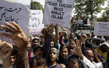 Pakistani traders demonstrate to condemn derogatory references to Islam and the Prophet Muhammad recently made by Nupur Sharma, a spokesperson of the governing Indian Hindu nationalist party, Friday, June 10, 2022, in Lahore, Pakistan. (AP Photo/K.M. Chaudary)