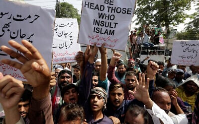 Pakistani traders demonstrate to condemn derogatory references to Islam and the Prophet Muhammad recently made by Nupur Sharma, a spokesperson of the governing Indian Hindu nationalist party, Friday, June 10, 2022, in Lahore, Pakistan. (AP Photo/K.M. Chaudary)