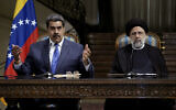 Venezuela's President Nicolas Maduro, left, speaks in a joint news briefing with his Iranian counterpart Ebrahim Raisi at the Saadabad Palace in Tehran, Iran, June 11, 2022. (AP Photo/Vahid Salemi)