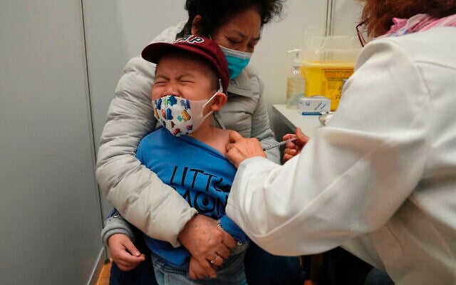 A boy receives a dose of China's Sinovac COVID-19 coronavirus vaccine at a community vaccination center in Hong Kong on Feb. 25, 2022. (AP Photo/Kin Cheung, File) A boy receives a dose of China's Sinovac COVID-19 coronavirus vaccine at a community vaccination center in Hong Kong on Feb. 25, 2022. (AP Photo/Kin Cheung, File)