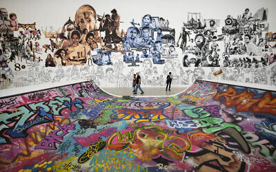 Illustrative: Visitors walk past a display during the press preview of Documenta 15, one of the world's most significant exhibition of contemporary art, in Kassel, Germany, Wednesday, June 15, 2022. (AP Photo/Martin Meissner)