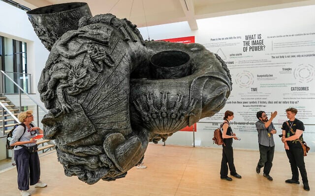 Mexican artist Erick Beltran, 2nd from right, explains his artwork during the press preview of the documenta fifteen, the world's most significant exhibition of contemporary art, in Kassel, Germany, June 15, 2022. (AP Photo/Martin Meissner) Mexican artist Erick Beltran, 2nd from right, explains his artwork during the press preview of the documenta fifteen, the world's most significant exhibition of contemporary art, in Kassel, Germany, June 15, 2022. (AP Photo/Martin Meissner)